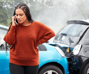 Woman on phone after car accident