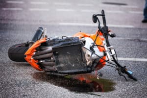 Orange Motorcycle Crashed on Road 