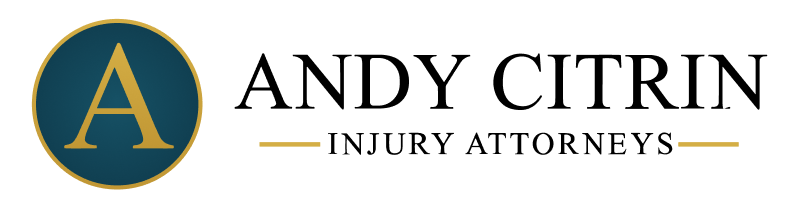 A gold letter "A" in a blue circle is followed by the word "Atkinson" in gold text with horizontal gold lines on both sides, on a black background.