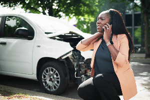 young woman with injured neck after fender bender